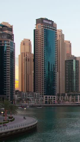 View on Dubai Marina modern Towers from night to day. Time Lapse.