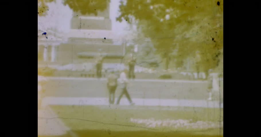 Guards in traditional ussr uniforms walking against the backdrop of the Eternal Flame monument. Volgograd, Russia. Archival video, film 1970s