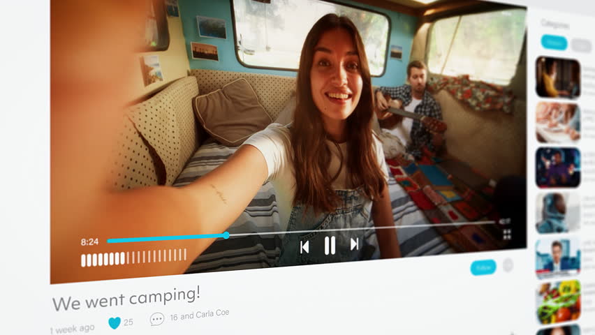 Couple of Influencers Sharing Their Camping Holiday Online on a Social Media Platform. Video with a Beautiful Young Female and Male Enjoying Time in a Caravan, Waving Hello to Viewers - Powered by Shutterstock - Get 15% off with code: PIKWIZARD15