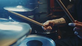 A talented drummer passionately performs, highlighting intricate rhythms while capturing the audience's attention. The energy in the studio creates an electric atmosphere for music lovers. - Powered by Shutterstock - Get 15% off with code: PIKWIZARD15