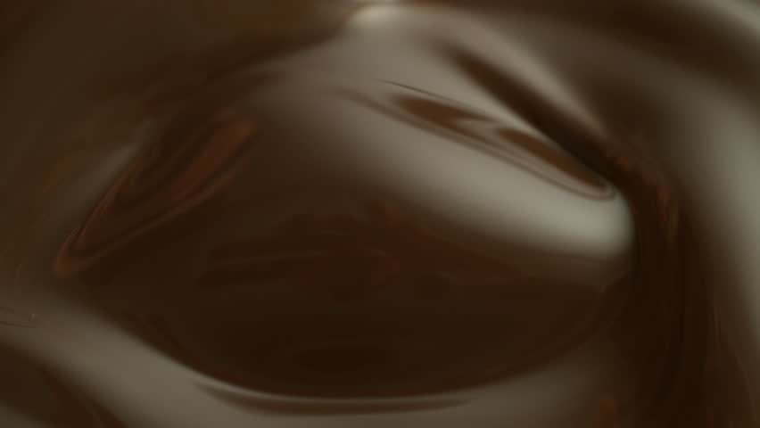 Super Slow Motion of Melted Chocolate with Falling Strawberry . Filmed on High Speed Cinema Camera, 1000 Fps