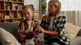 Family argument. Offended upset little Caucasian girl child daughter cross arms ignore mother parent woman at home caring guilty mom female touch schoolgirl kid speaking talk apologize quarrel trouble - Powered by Shutterstock - Get 15% off with code: PIKWIZARD15