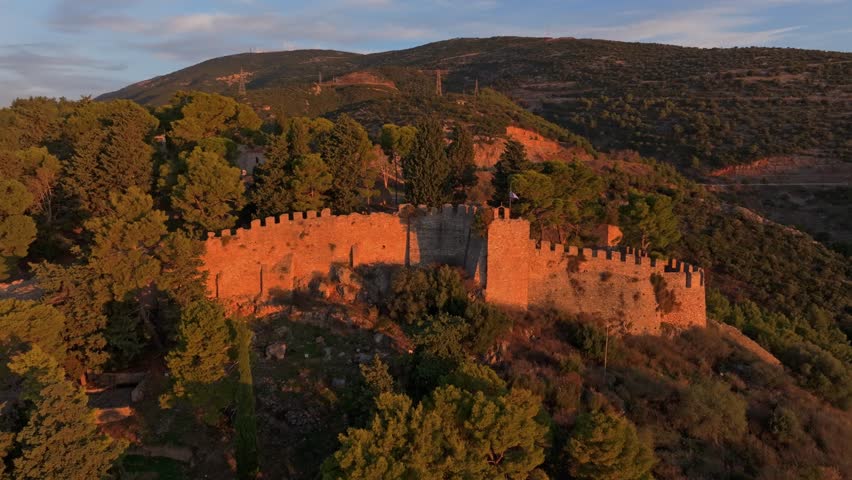 Aerial view of the serene Nafpaktos Venetian Port and the majestic Venetian Castle of Nafpaktos at sunrise, Nafpaktos, Greece.
