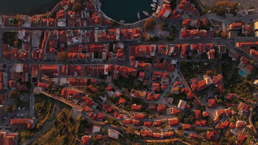 Aerial view of Naupactus with its historic Nafpaktos Venetian Port at sunrise, Nafpaktos, Greece.