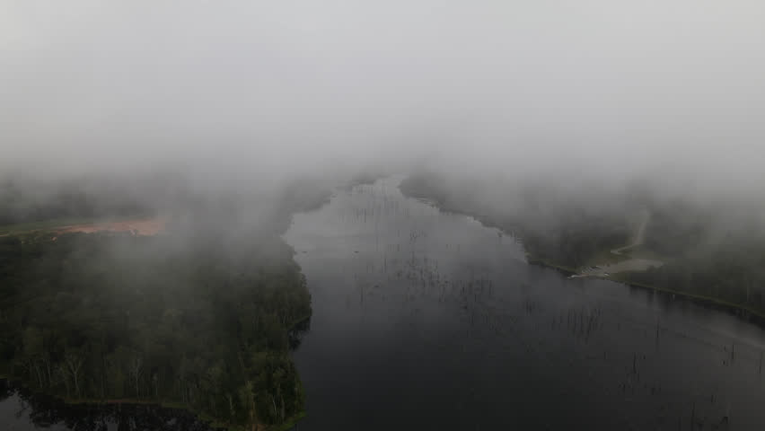 Flying Through The Fog Over The River. - aerial shot