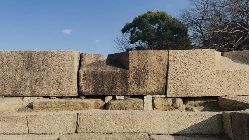 An embrasure hole in Osaka castle ringwork outer stone curtain walls, where samurais can aim their musket guns at enemies that breach through gates.