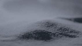 Fine sugar particles cascading in slow motion, forming delicate dunes and patterns up close - Powered by Shutterstock - Get 15% off with code: PIKWIZARD15