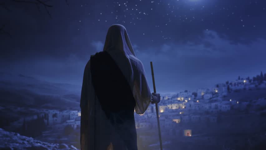 Hooded Figure Overlooks Ancient City At Night Middle Eastern Village Spiritual Journey