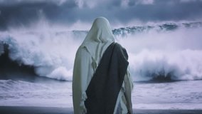Mysterious Cloaked Figure Observes Stormy Ocean Waves Dark Moody Atmospheric Scene - Powered by Shutterstock - Get 15% off with code: PIKWIZARD15