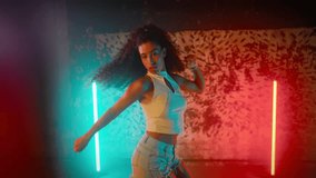 Talented African woman dancing hip-hop and ethnic choreography, energy of music . Attractive mixed race female dancer moving slowly by favorite song in dance class, slender body of beautiful lady - Powered by Shutterstock - Get 15% off with code: PIKWIZARD15
