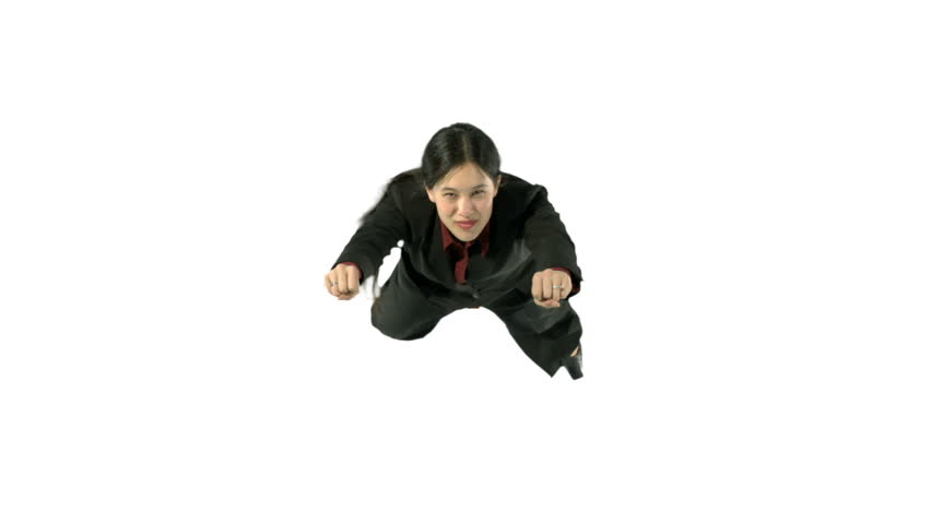 Young woman in a business suit flies towards the camera, then flies out of shot.