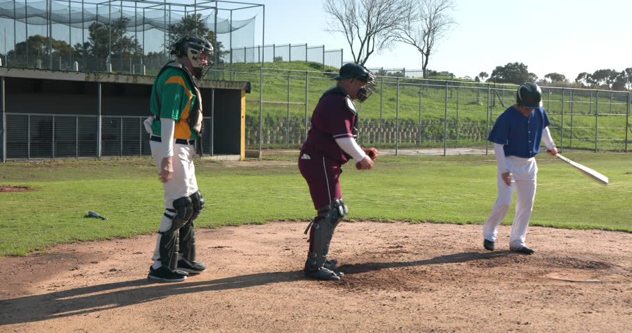 Playing baseball, batter preparing to hit while catcher and umpire ready. Sports, game, athlete, competition, team, action