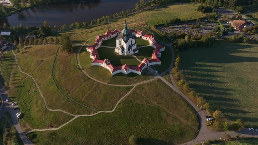 Aerial view of the beautiful Pilgrimage Church of Saint John of Nepomuk surrounded by serene greenery and tranquil fields, Zdar nad Sazavou, Czech Republic.