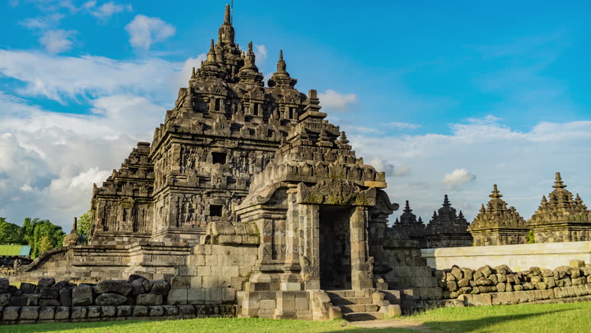 4K Timelapse of Plaosan Temple in the afternoon with golden sunlight and clear skies. This iconic Javanese heritage site in Central Java showcases serene beauty and rich cultural history.