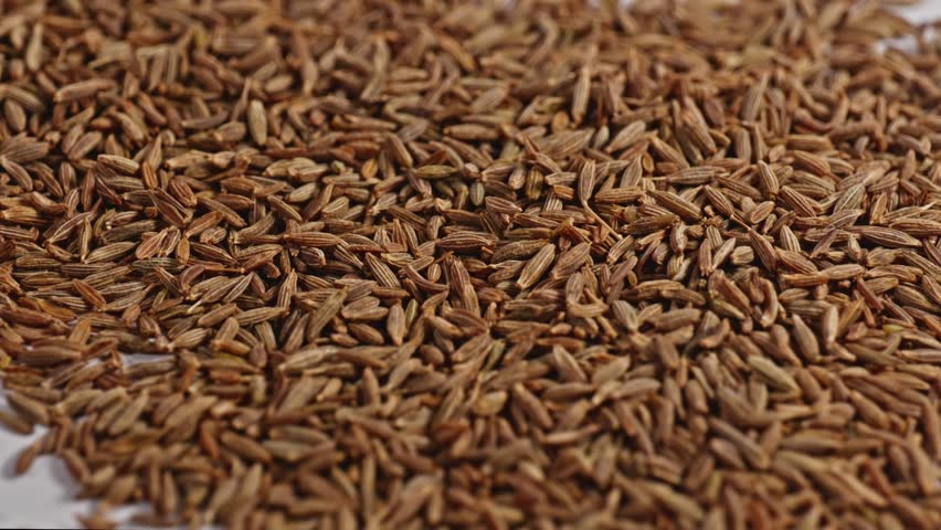 cumin seeds or jeera close up, parallax shot, 4k