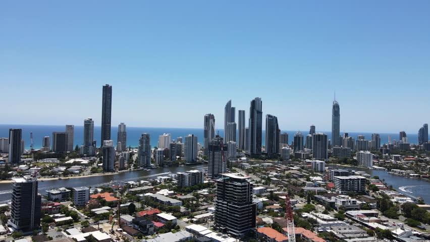 Gold Coast suburb of Chevron Island and the towering buildings of Surfers Paradise and Broadbeach. Moving drone view