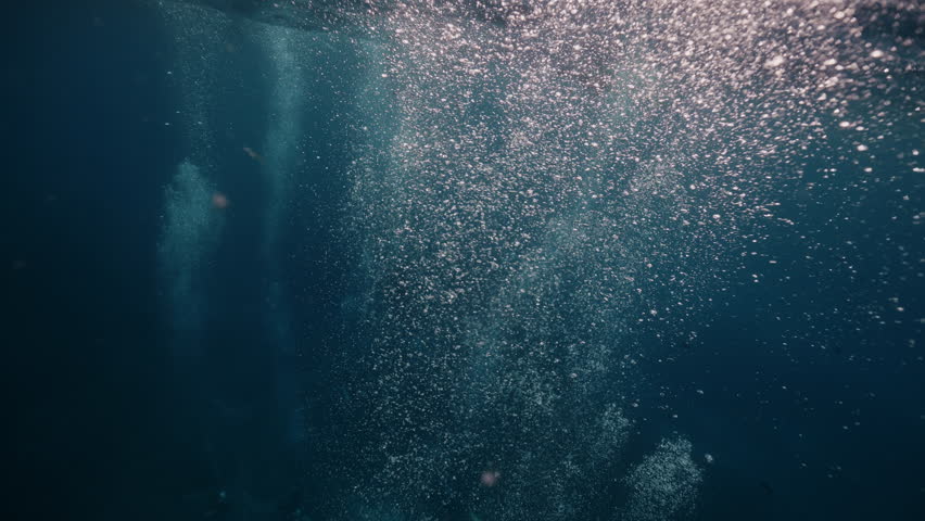 air bubbles underwater, super slomo, diving oxygen, bubbles in the ocean water, marine life, slowmotion, bubbles ascending to surface, aquatic light rays and refractions, shot in 4k, in Tulamben Bali