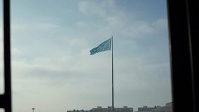 The national flag of the Republic of Kazakhstan flutters in the wind on a flagpole - Powered by Shutterstock - Get 15% off with code: PIKWIZARD15