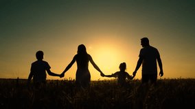 Happy family of farmers with children go through wheat field. Mom dad kids are walking together, silhouette. Dad mom little daughter son play enjoy nature outdoors. Slow motion. Family Dreams. Parents - Powered by Shutterstock - Get 15% off with code: PIKWIZARD15