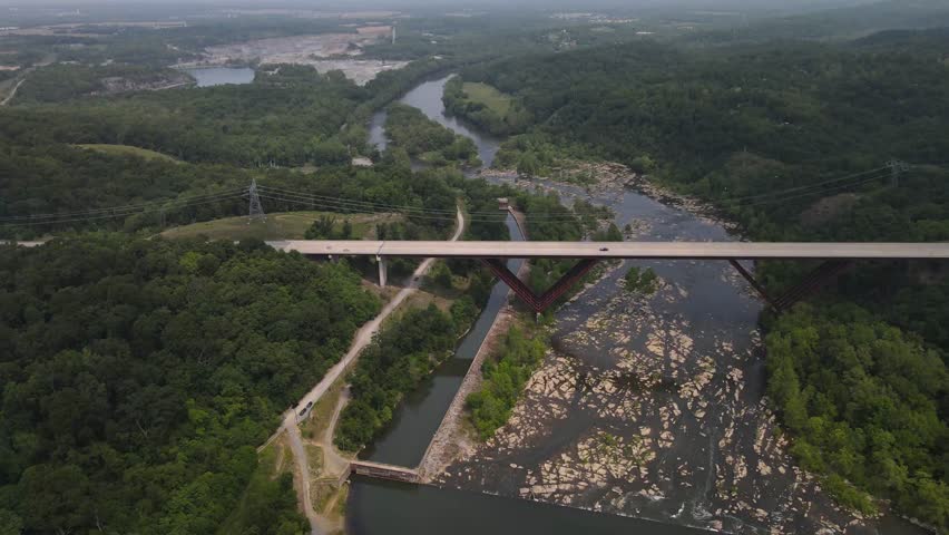 Bridge over the Shenandoah River. Dense green forest. View from above.