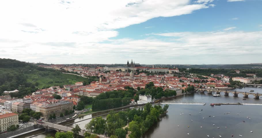 Aerial view Charles Bridge, Vltava river in Prague, Czech Republic. City panorama. Panoramic view Prague old town. Drone flight over the Prague city, top view. Vltava River.