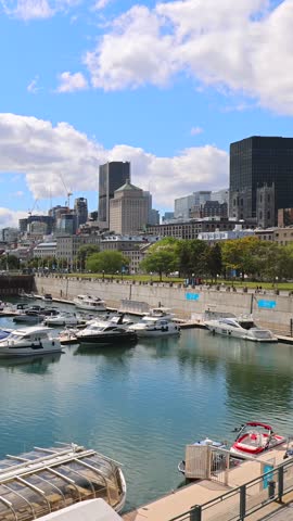 Panoramic view of Montreal modern skyline of downtown financial city center and Old Port of Montreal facing Saint Lawrence River.