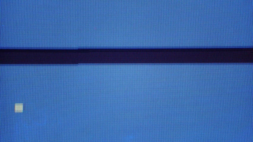 VHS tape playback showing static noise and glitches, transitioning into a continuous looping black line on blue screen