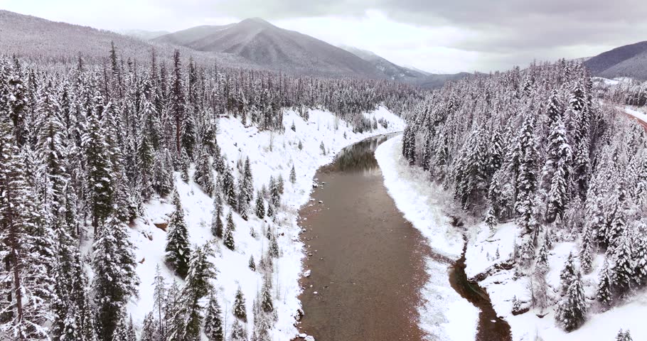 Flathead River and Forest Aerial Drone Glacier National Park Winter