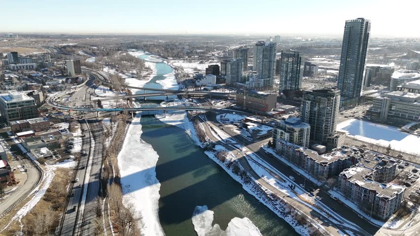 Aerial overpass with downtown traffic overlooking apartment building and tower blocks in Calgary Alberta Canada.