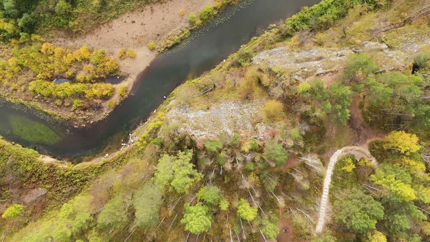 Bazhukovo, Russia. Svetlaya Rock. Autumn landscape. Serga River. Deer streams - nature park in a wooded area, famous for its rich flora, Aerial View, MasterShots, Tilt up, Tilt down, Descend