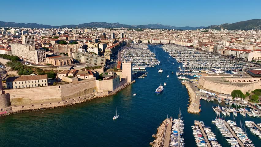 aerial view of Marseille harbour with fort Saint Jean, establishing shot of Marseille city in France, French city of Marseille in Provence