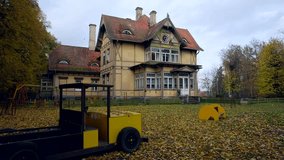 Haunted House. 100 Year Old German Style Building. Playground In The Foreground. The Fale House. Its parts were made in Germany, numbered, and brought to Ligatne to build a guest house. - Powered by Shutterstock - Get 15% off with code: PIKWIZARD15