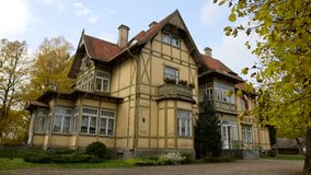 Haunted House. 100 Year Old German Style Building. Entrance. Autumn. The Fale House. Its parts were made in Germany, numbered, and brought to Ligatne to build a guest house. - Powered by Shutterstock - Get 15% off with code: PIKWIZARD15