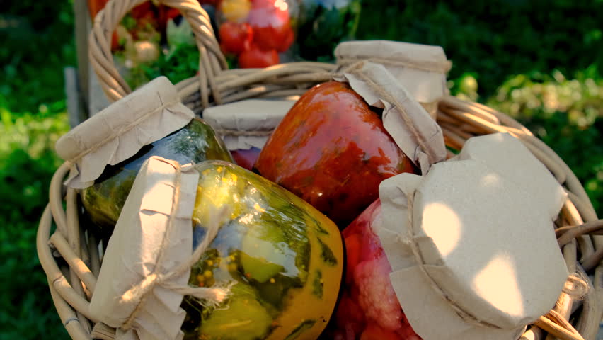 Canning and vegetables in the garden. Selective focus.