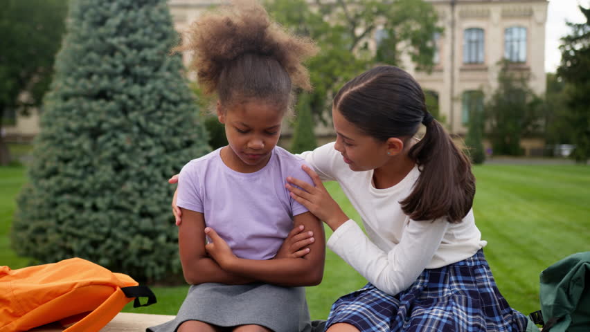 African Latina pupils primary school education little girls teen students schoolgirls studying children kids sad upset offended worried conflict sorry friend calm help support friendship city outdoors