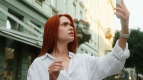 Confused puzzled upset girl woman female tourist using mobile phone outdoors Caucasian businesswoman talk smartphone outside loss connection bad signal internet wi-fi roaming problem travel in city - Powered by Shutterstock - Get 15% off with code: PIKWIZARD15