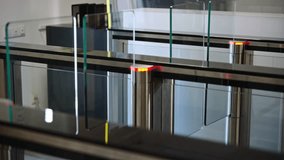 Passing through a turnstile into an office building. Office workers enter and exit through a modern turnstile, using a key card to enter. - Powered by Shutterstock - Get 15% off with code: PIKWIZARD15