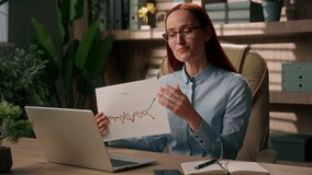 Caucasian woman video call online conference meeting business presentation graph chart sales good result laptop chatting talk smiling girl saleswoman broker trader businesswoman negotiation in office - Powered by Shutterstock - Get 15% off with code: PIKWIZARD15