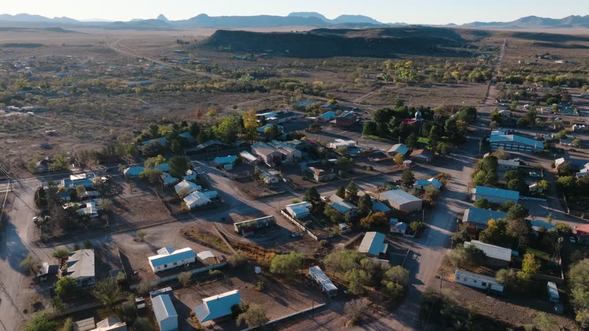 Rural Texas Town at Sunrise, Fort Davis in West Texas small town golden hour drone city orbit in 4k