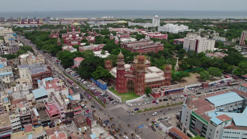 High Court of Judicature at madras background tamil nadu secretariat with port area and heavy traffic with crowded residentials buildings in chennai, tamil nadu, day time semi orbit drone shot