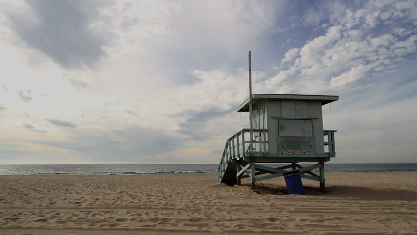 Empty beach with a lifeguard hut in California, USA, looking out towards the