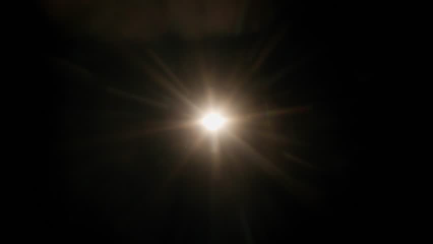 Real optical lens flare on black background