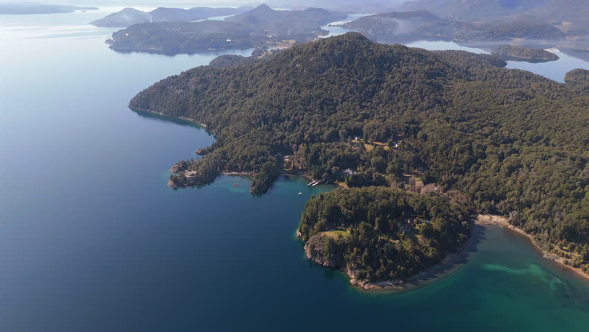 High aerial over clear Nahuel Huapi Lake and forest near Bariloche, Patagonia