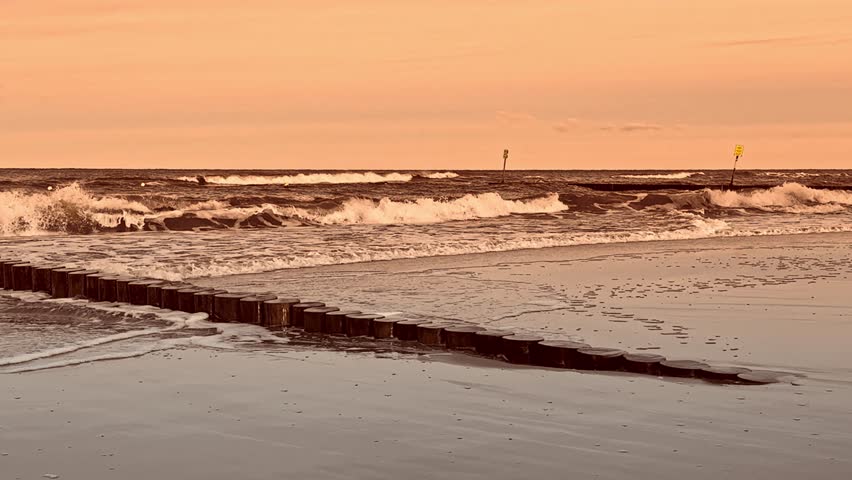 Serenity of the ocean captured by a dedicated photographer amidst vibrant sunset hues