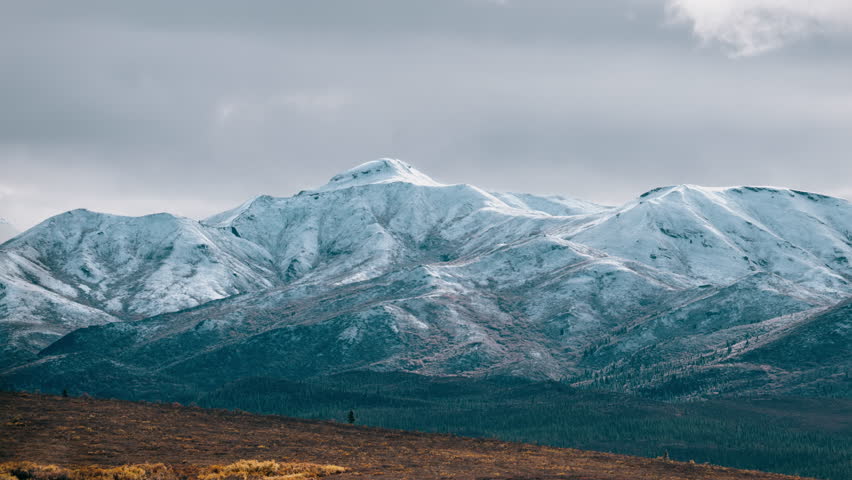 Golden hour Timelapse of clouds over an autumn scene in Denali National Park near Mt. McKinley, autumn