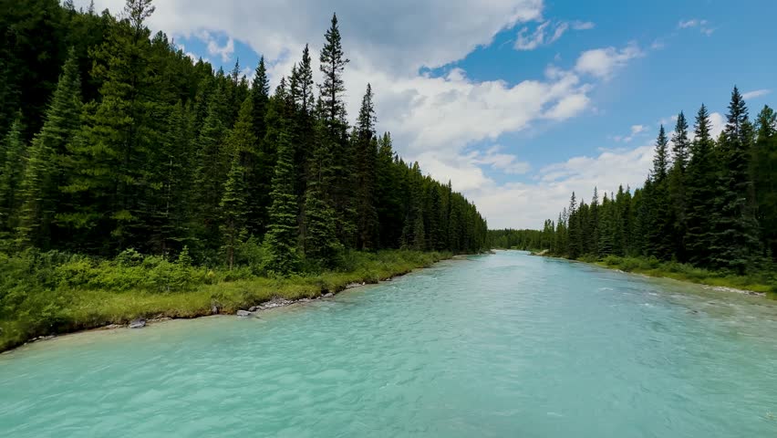 Glacier National Park in Montana on the border with Canada. Crossing Going to the Sun Road. Green valleys, spectacular mountain peaks, mountain goats. Glacial lakes. House.