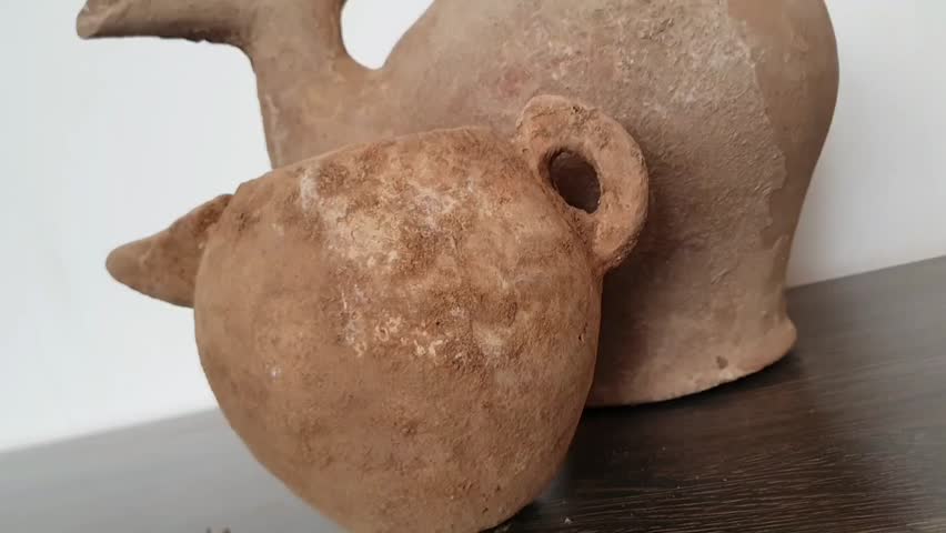 4K footage of rare ancient pottery and burial artifacts from excavations. These relics showcase lost craftsmanship and cultural heritage, ideal for documentaries and history films.