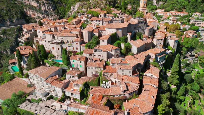 Aerial view of the medieval village of Eze on the Mediterranean coast, French Riviera, France. Historic town of Eze perched on a hilltop, surrounded by breathtaking landscapes and turquoise sea waters