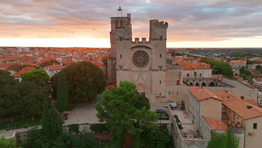 Magnificent Cathedral of Saint Nazaire in Beziers at sunrise, Southern France. Aerial view of the Beziers old town in France.
