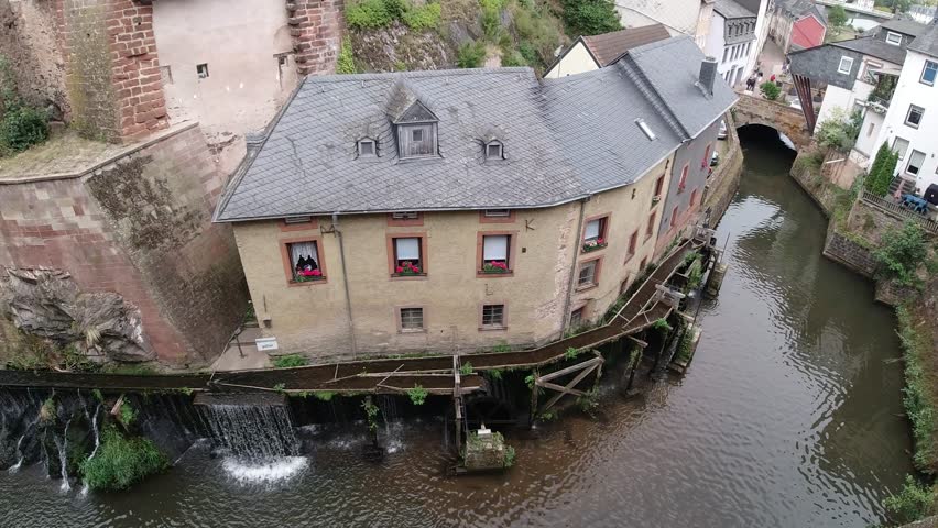 Traditional water mill building on the saar river in saarburg, germany. 